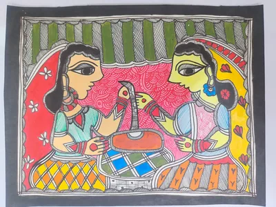Two women in traditional attire preparing or serving food